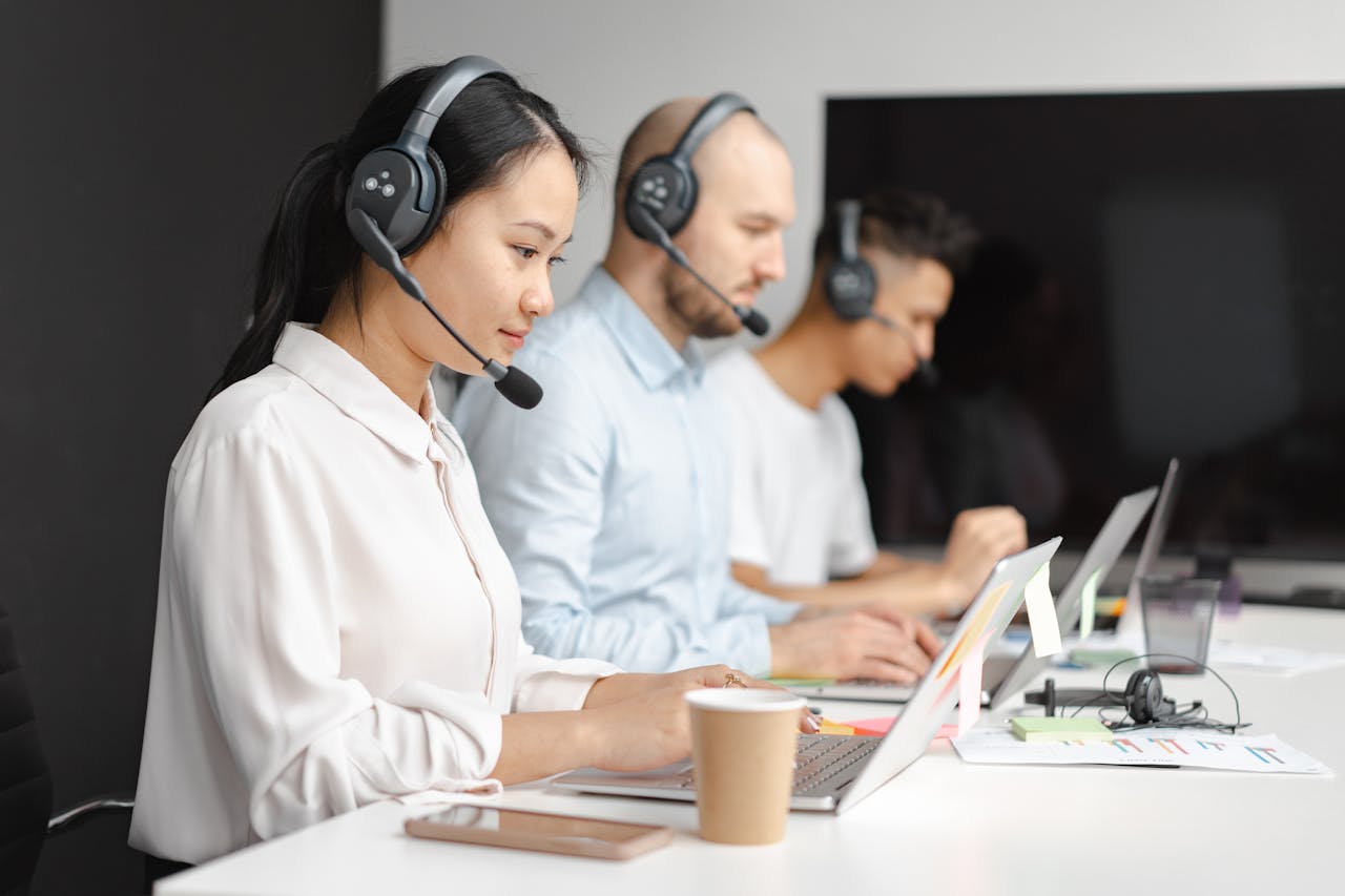 Customer service reps wearing headsets