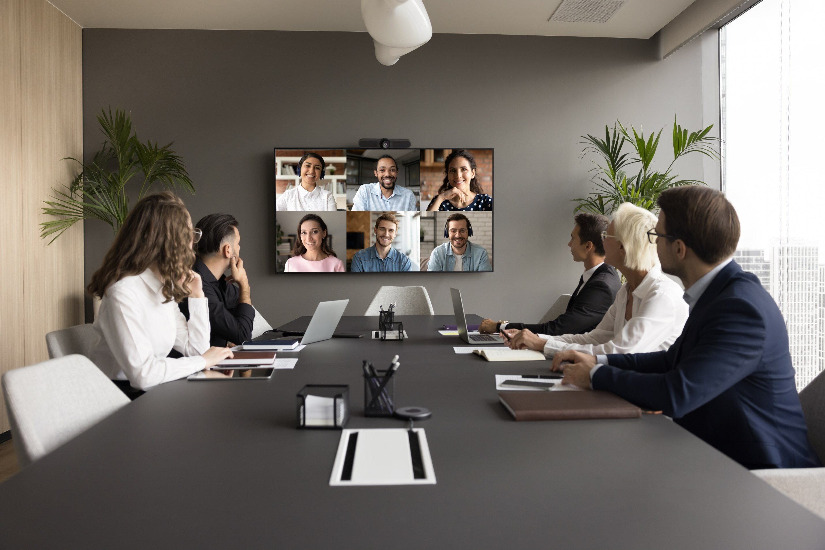 A group of business professionals in a remote meeting