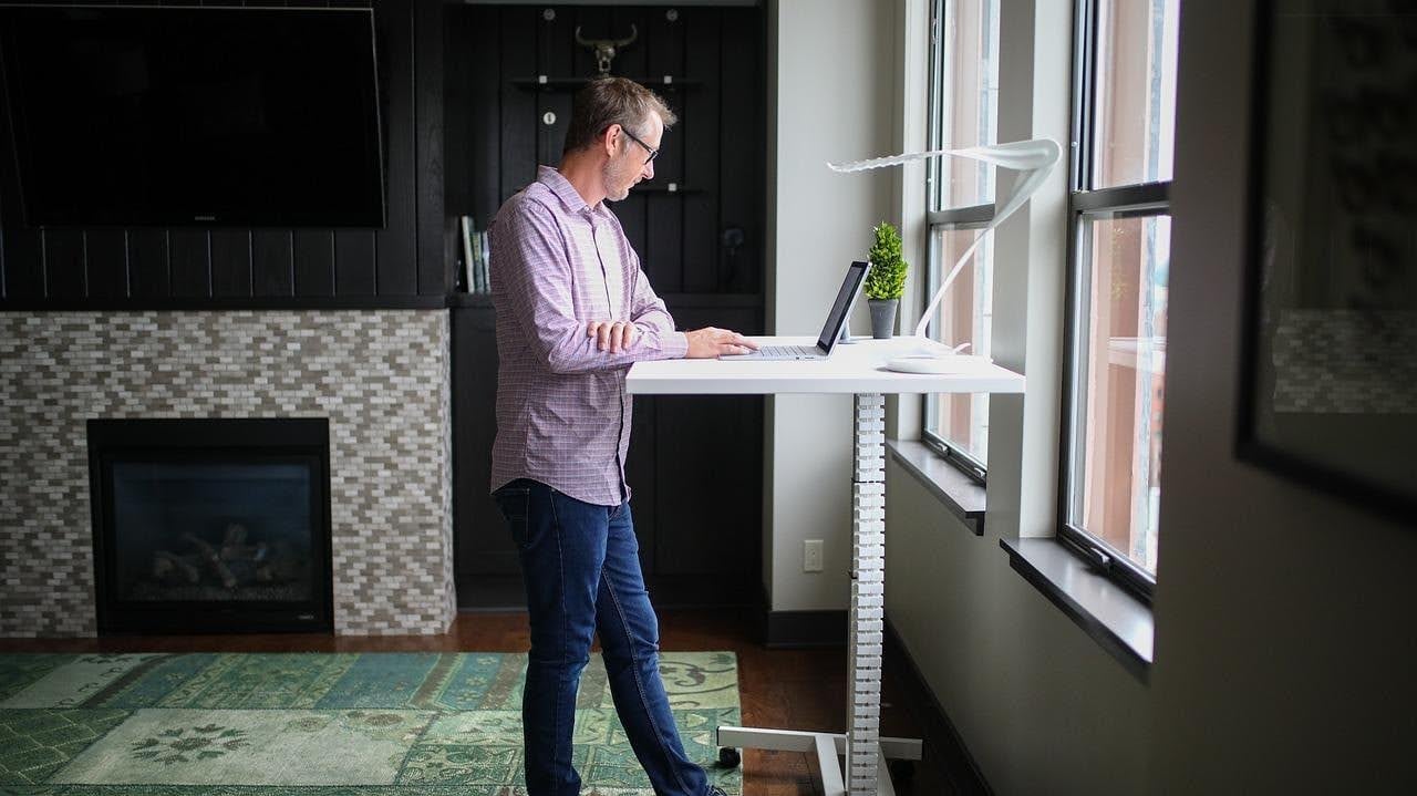 Man working at standing desk.