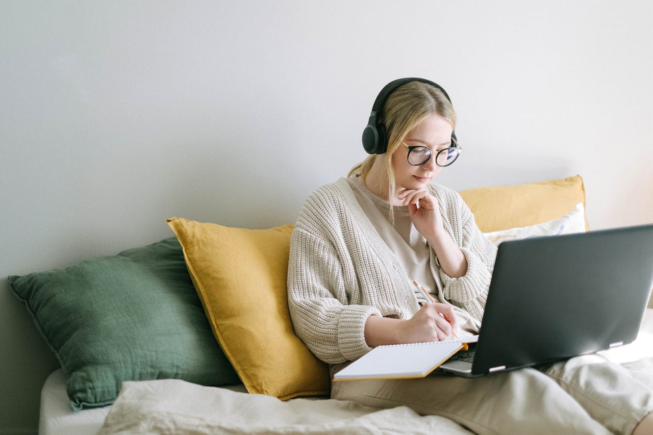 Woman wearing a wireless headset and working